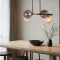 Lampa wisząca Kama 4x28W G9 czarna i złota, klosze grafitowe i bursztynowe, styl nowoczesny, elegancka oprawa sufitowa 34-47595 Candellux