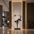 Lampa podłogowa WOMAN ARTISTIC 200 cm - czarna figura akrobatki ze złotą kulą F9320 Step into Design